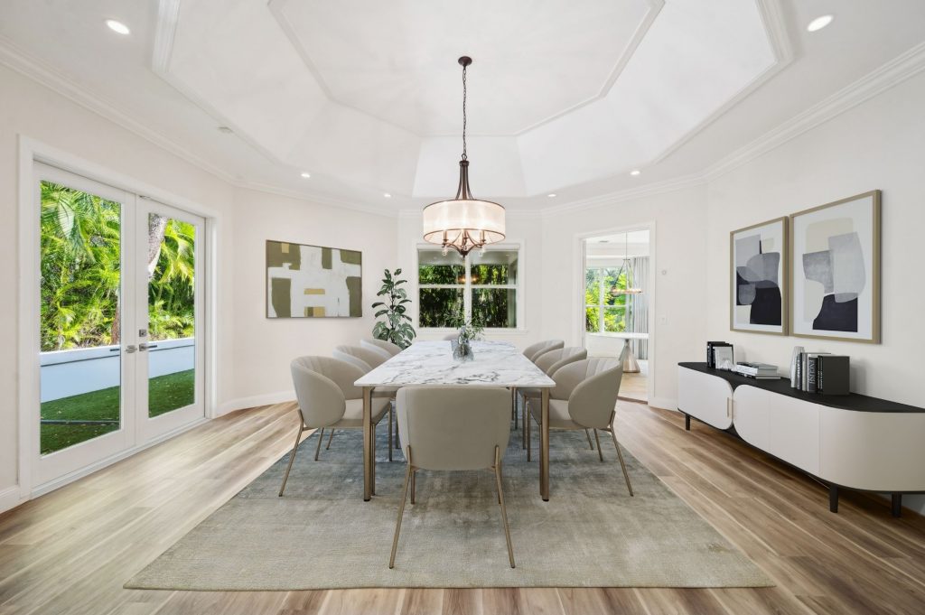 Elegant formal dining room with octagonal coffered ceiling and marble-top dining table