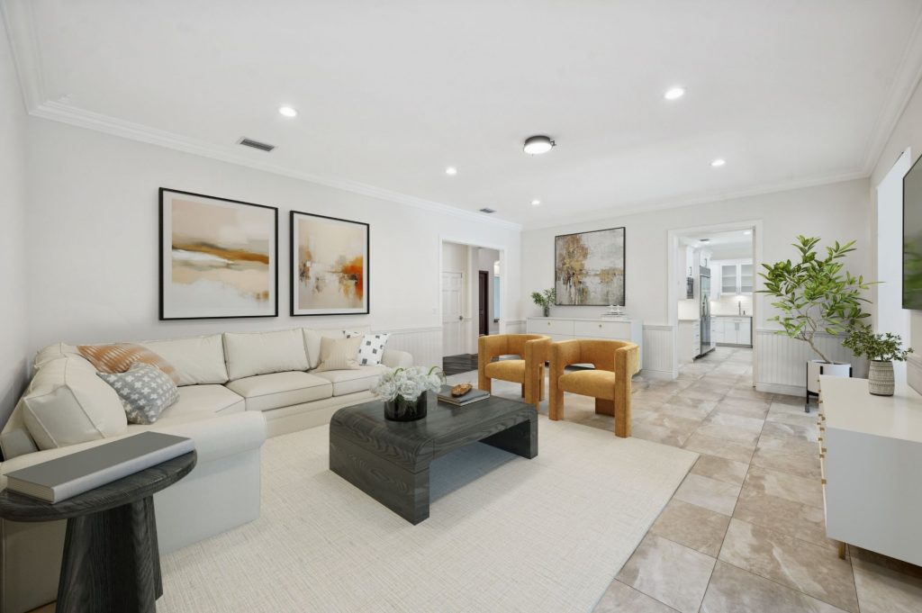 Spacious family room with cream sectional sofa and mustard velvet accent chairs